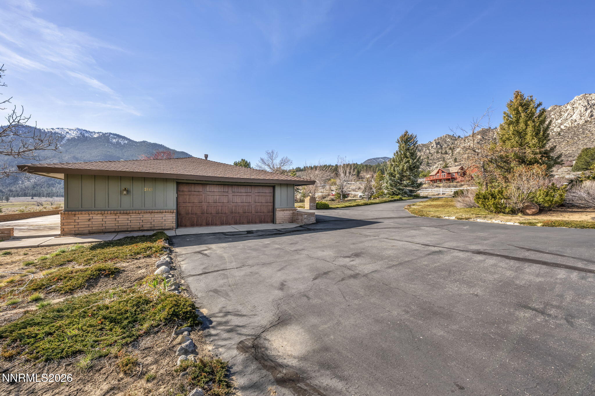 3464 Alpine View Court Carson City, NV 89705 - Photo 73 of 97 a view of a house with a yard and a large tree
