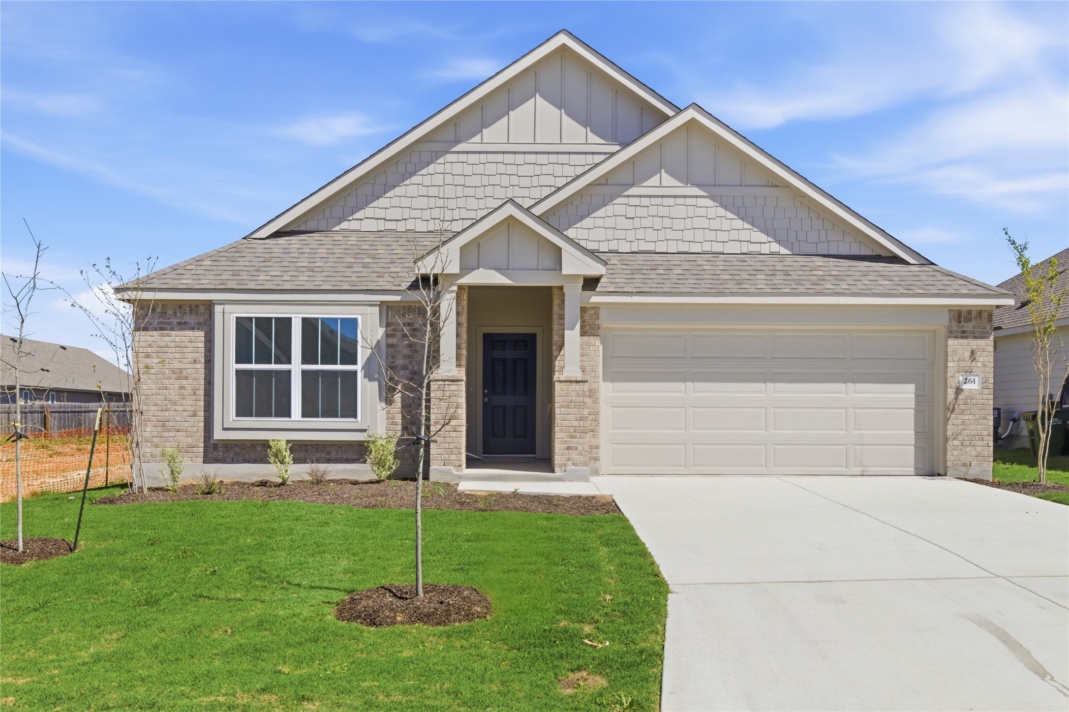 261 Seattle Slew Drive Jarrell, TX 76537 - Photo 1 of 1 a view of a house with a small yard plants and large tree