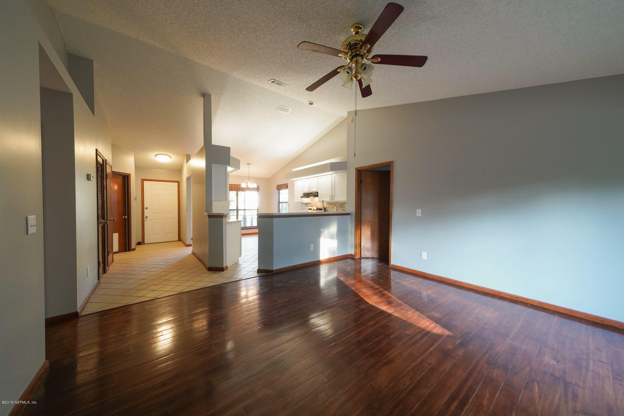 2148 Rothbury Drive Jacksonville, FL 32221 - Photo 23 of 36 a view of a hallway with wooden floor