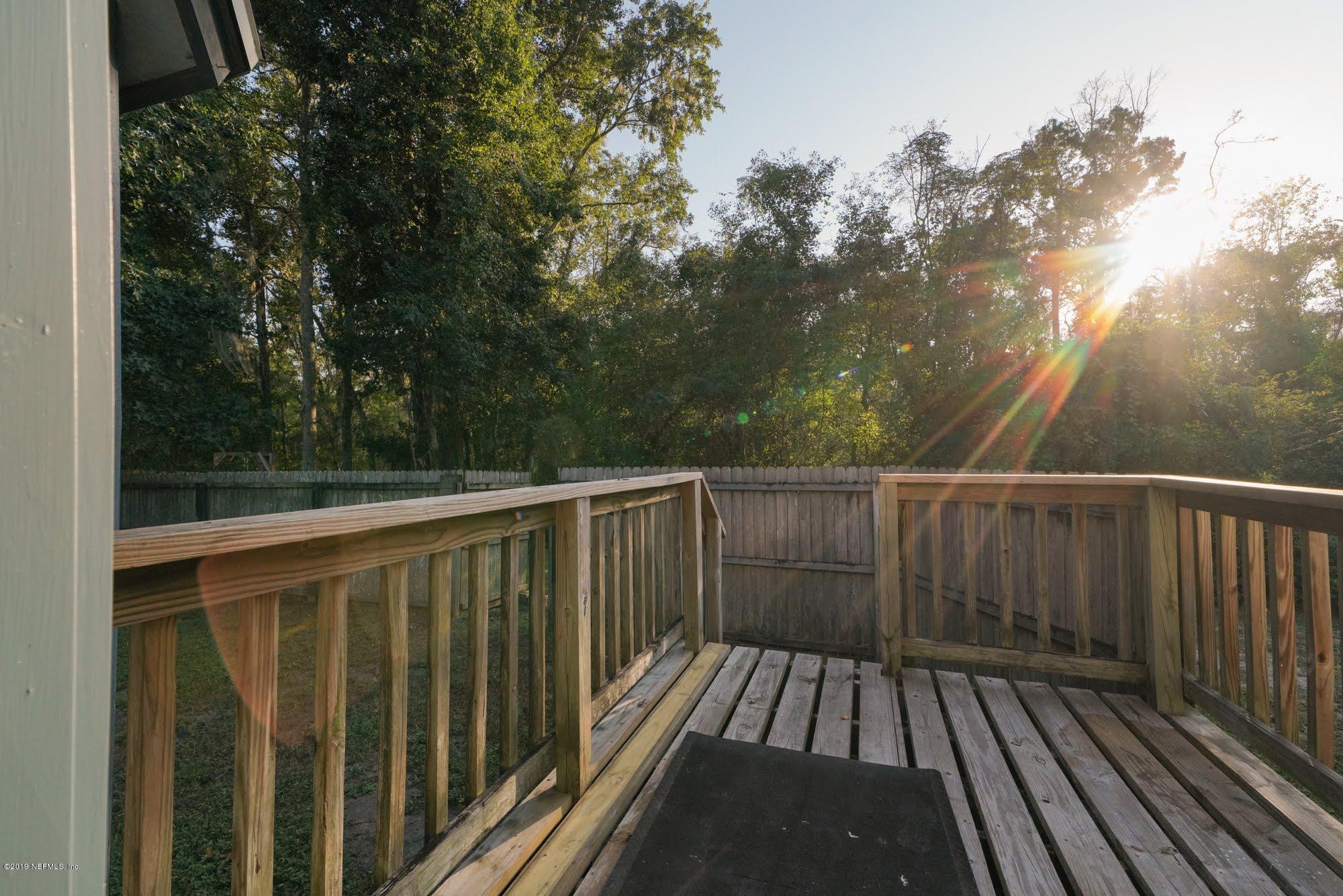 2148 Rothbury Drive Jacksonville, FL 32221 - Photo 24 of 36 a view of balcony with wooden floor and trees
