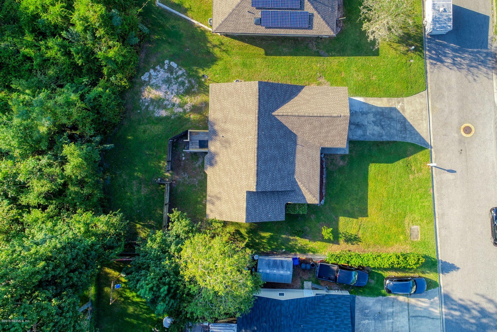 2148 Rothbury Drive Jacksonville, FL 32221 - Photo 31 of 36 an aerial view of a house with a garden and plants