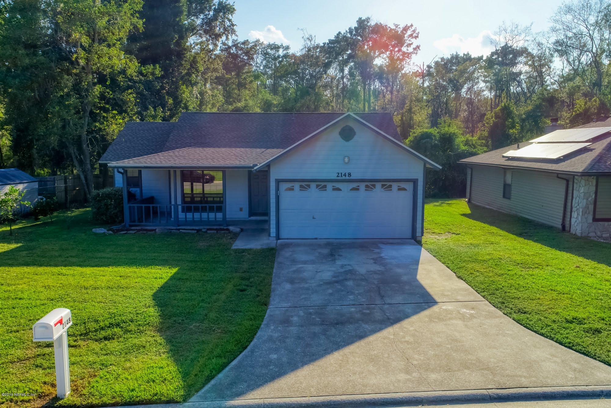 2148 Rothbury Drive Jacksonville, FL 32221 - Photo 34 of 36 a front view of a house with garden
