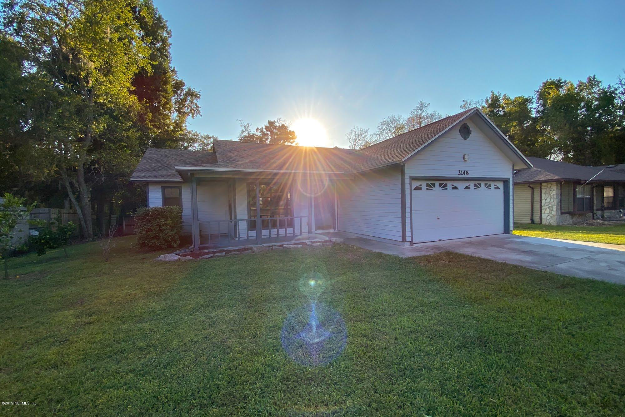 2148 Rothbury Drive Jacksonville, FL 32221 - Photo 36 of 36 a front view of a house with yard and green space