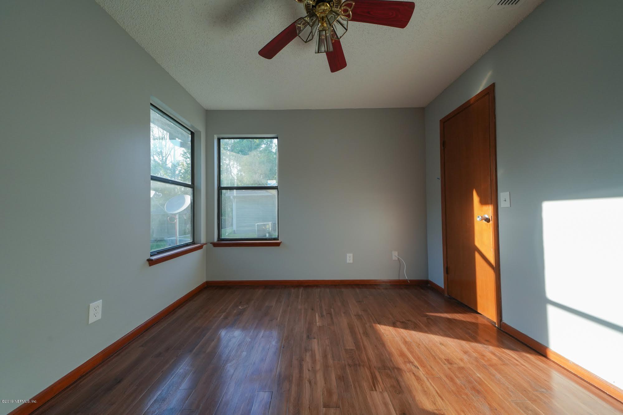 2148 Rothbury Drive Jacksonville, FL 32221 - Photo 6 of 36 a view of empty room with wooden floor and fan