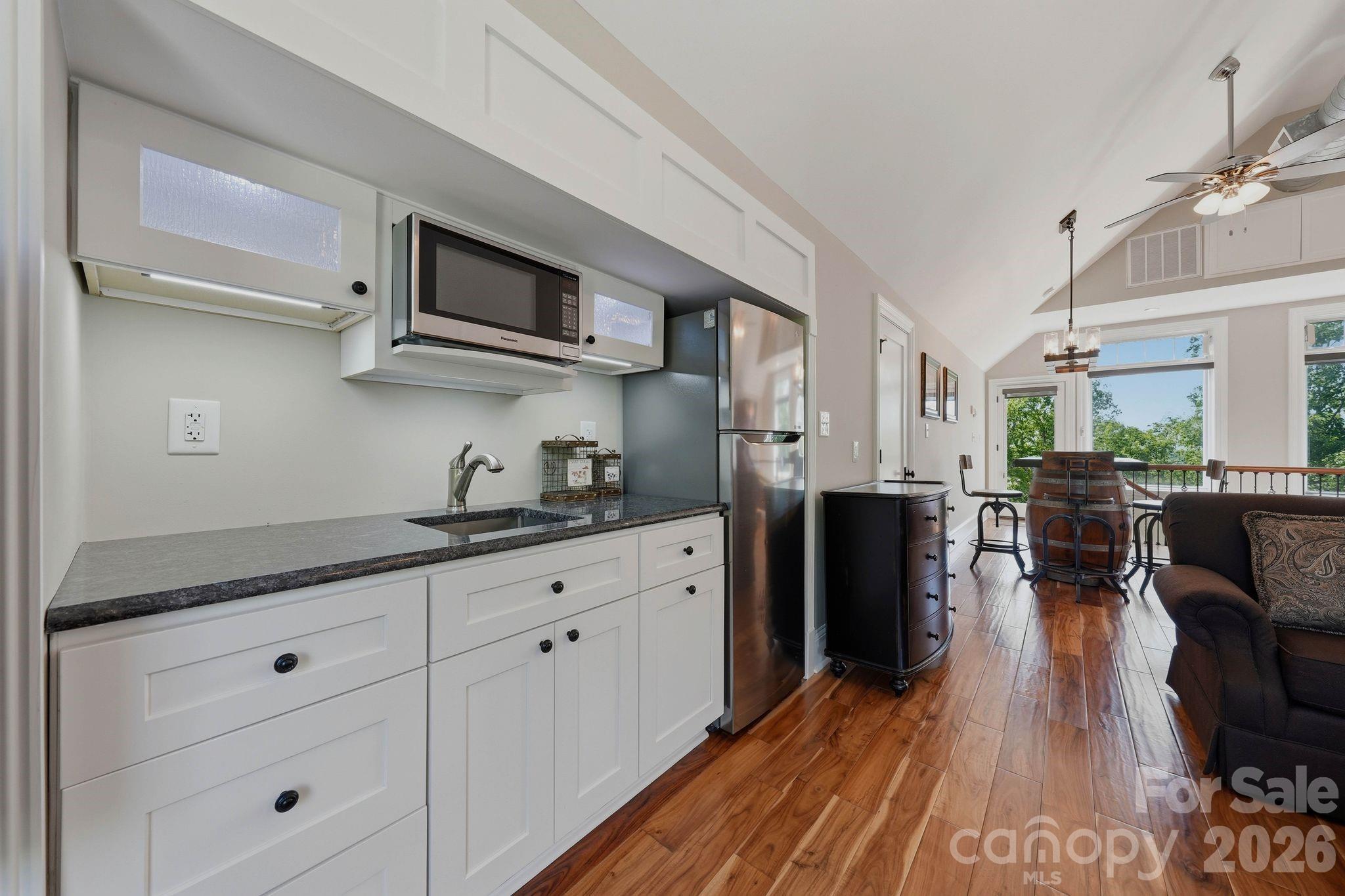 605 Recore Rdg Road Bessemer City, NC 28016 - Photo 29 of 47 a kitchen with stainless steel appliances granite countertop a lot of cabinets and wooden floor