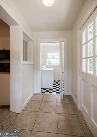 a view of an empty room with a window