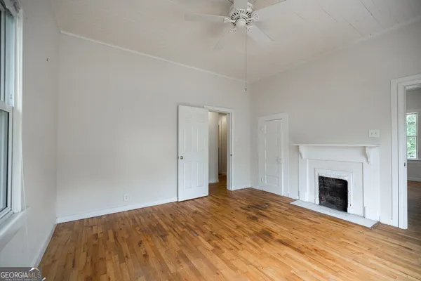 a bedroom with a bed and a fireplace