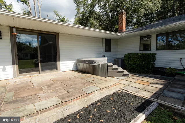 a kitchen with granite countertop a sink and a stove top oven