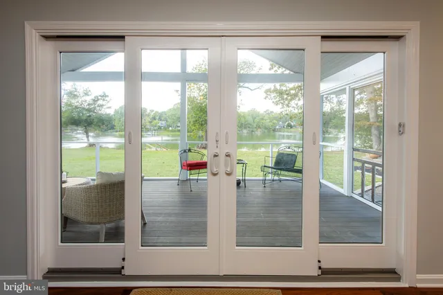 a kitchen with granite countertop a sink and a large window