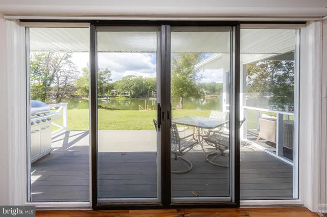 a living room with fireplace furniture and a wooden floor