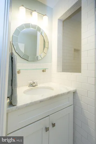 a bedroom with two beds and a window