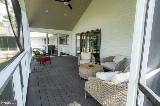 a large white kitchen with cabinets