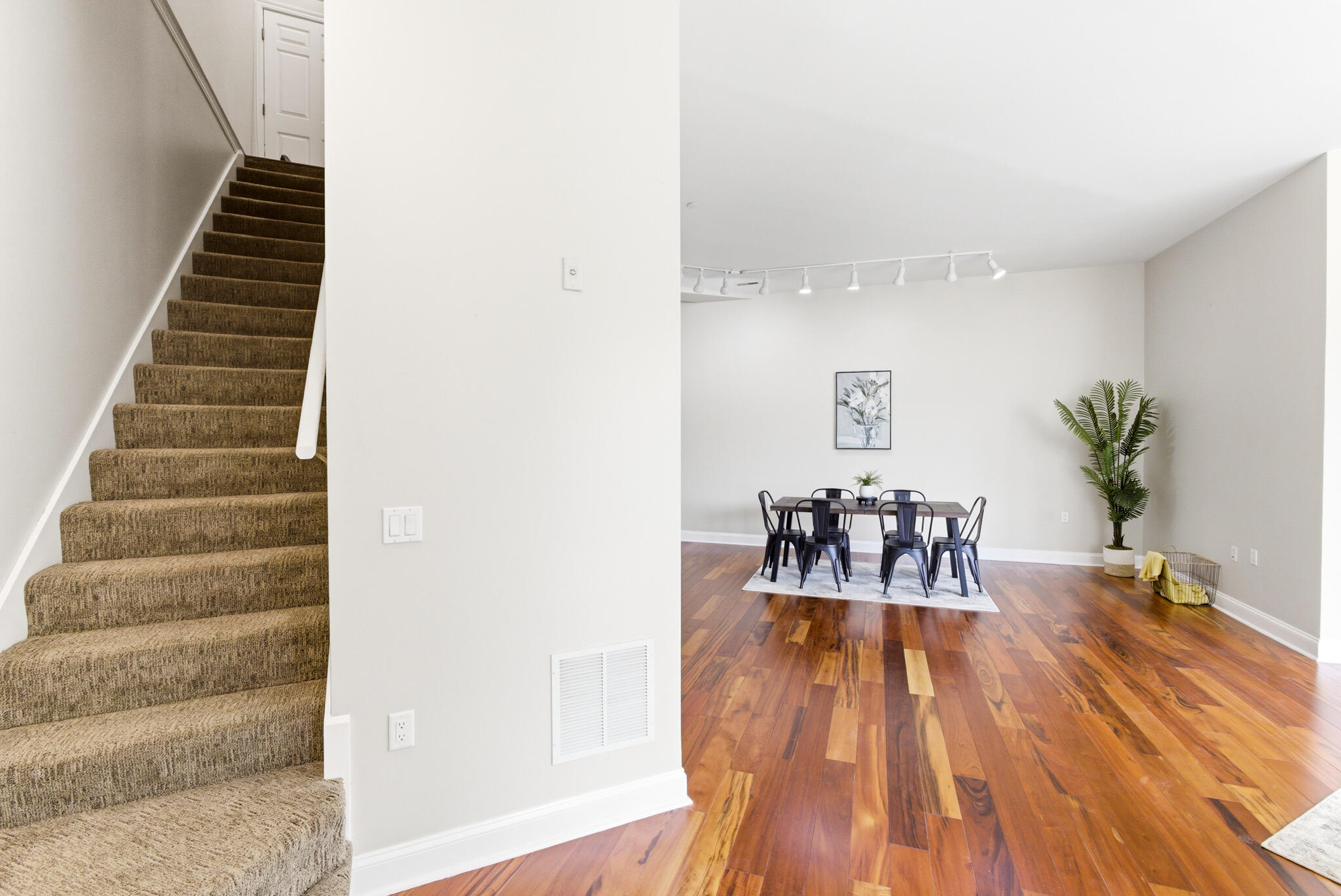 1888 North Water Street, Unit 101 Milwaukee, WI 53202 - Photo 11 of 26 Staircase takes you to the master suite and garage/amenities access.