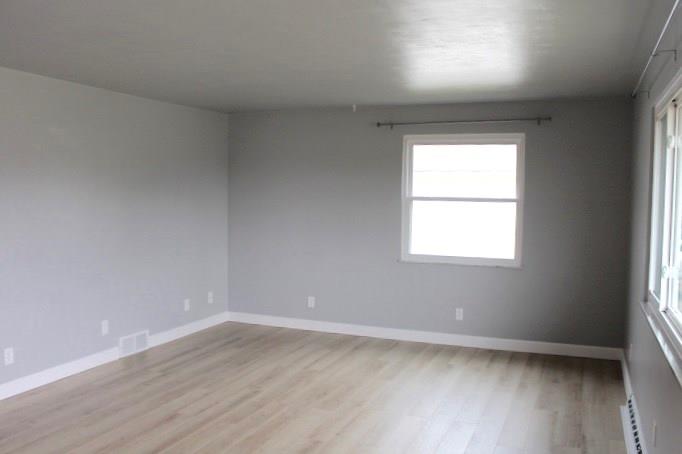163 Hall Road Aliquippa, PA 15001 - Photo 11 of 16 Living room side window and opposite side of room which offers tons of space for furnitue.
