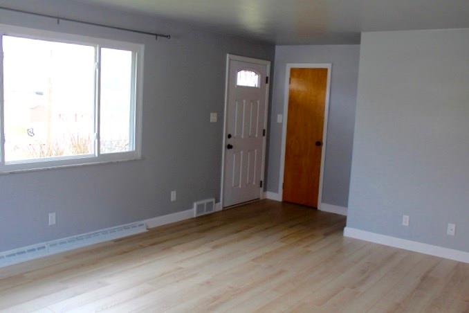 163 Hall Road Aliquippa, PA 15001 - Photo 9 of 16 Living room size is 19x14 with space for guests to enter and furniture with newer windows that bring in beautiful lighting