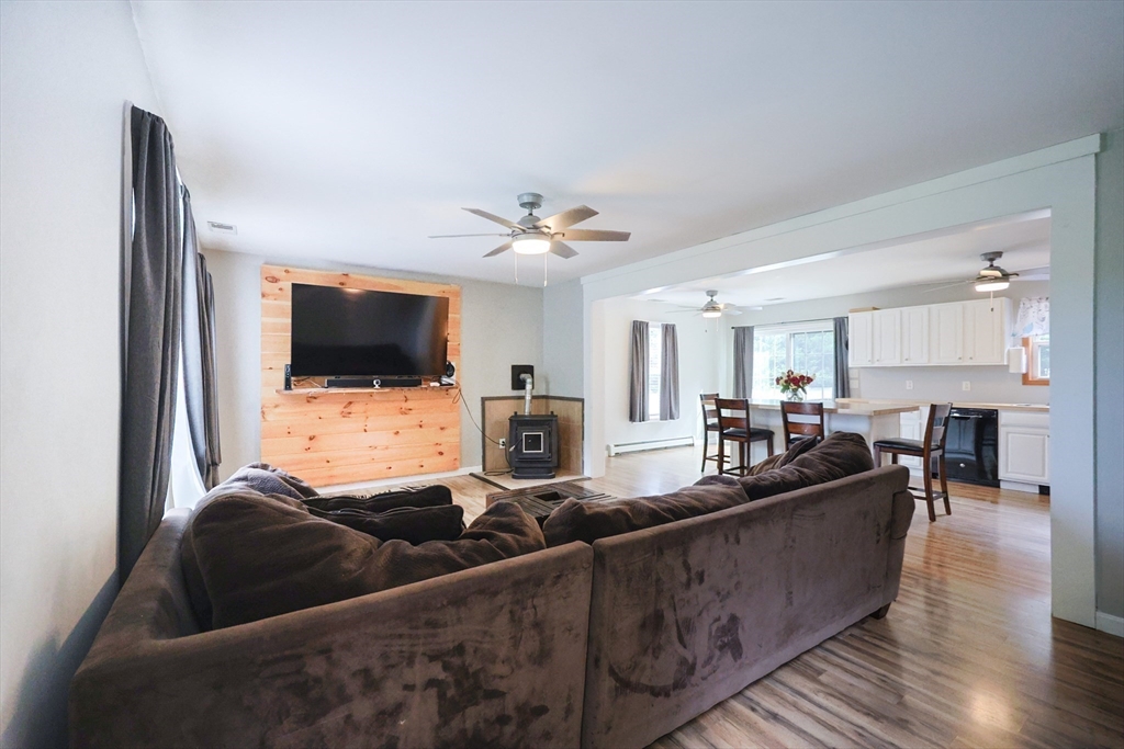 48 Wareham Street Carver, MA 02330 - Photo 14 of 42 a living room with furniture and a flat screen tv