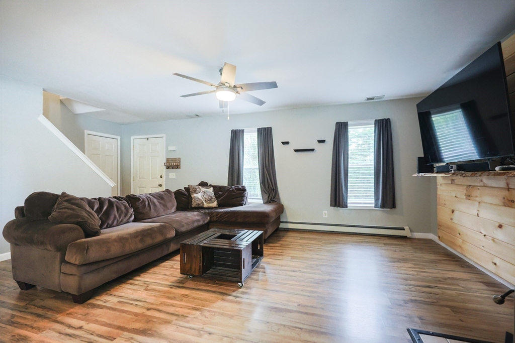 48 Wareham Street Carver, MA 02330 - Photo 17 of 42 a living room with furniture and a flat screen tv