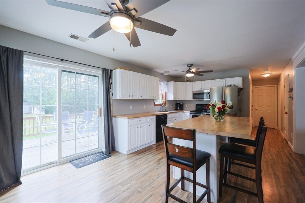 48 Wareham Street Carver, MA 02330 - Photo 19 of 42 a dining room with furniture window and wooden floor