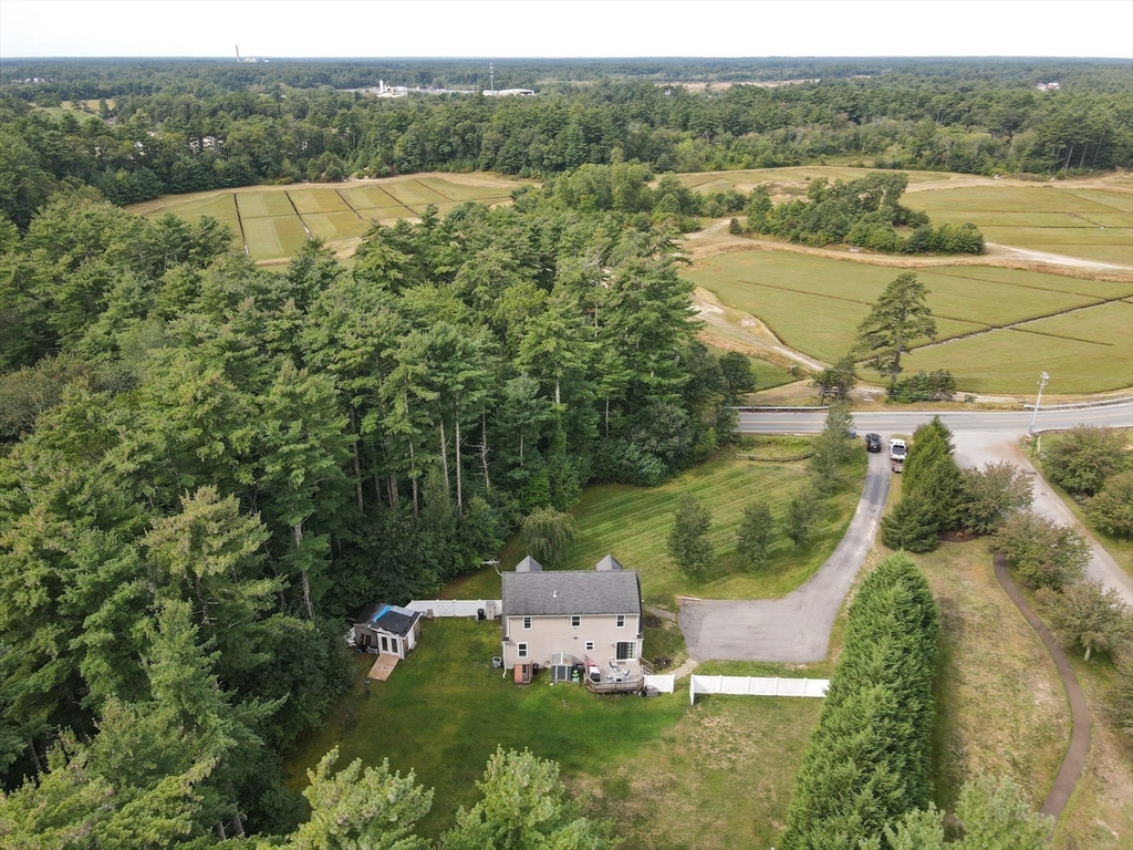 48 Wareham Street Carver, MA 02330 - Photo 2 of 42 a view of a lake with a yard