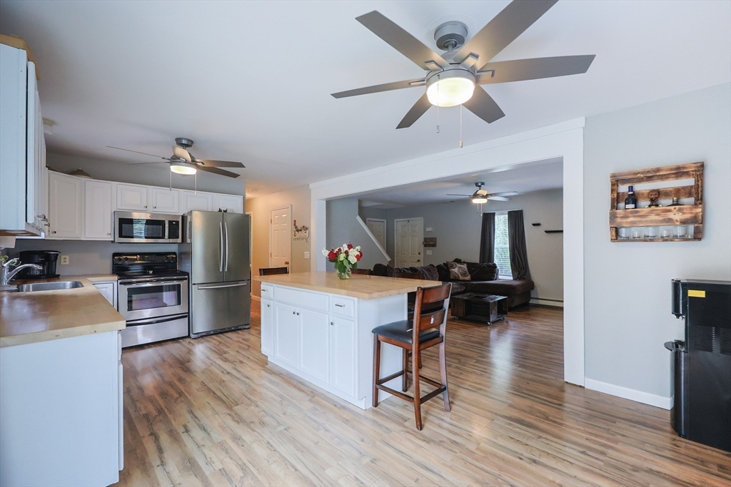48 Wareham Street Carver, MA 02330 - Photo 21 of 42 a living room with furniture and a wooden floor