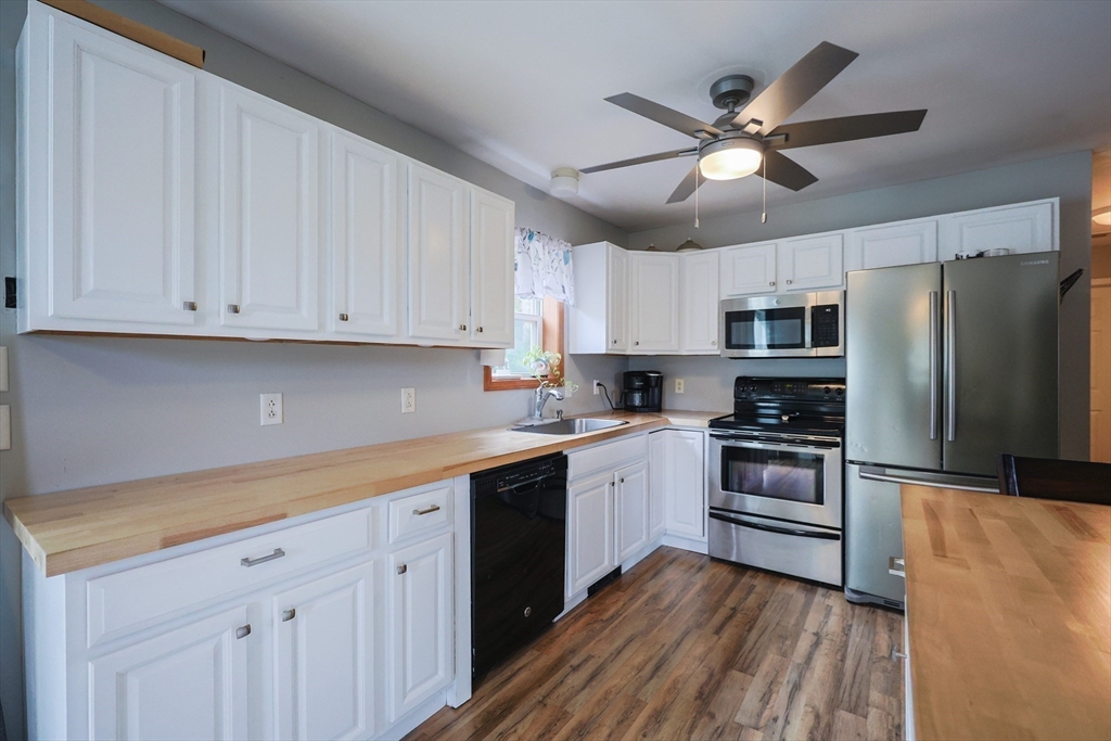 48 Wareham Street Carver, MA 02330 - Photo 22 of 42 a kitchen with cabinets stainless steel appliances and a window