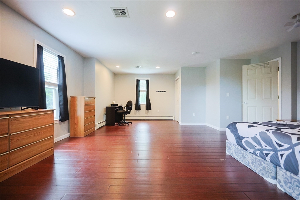 48 Wareham Street Carver, MA 02330 - Photo 31 of 42 a living room with furniture and a flat screen tv