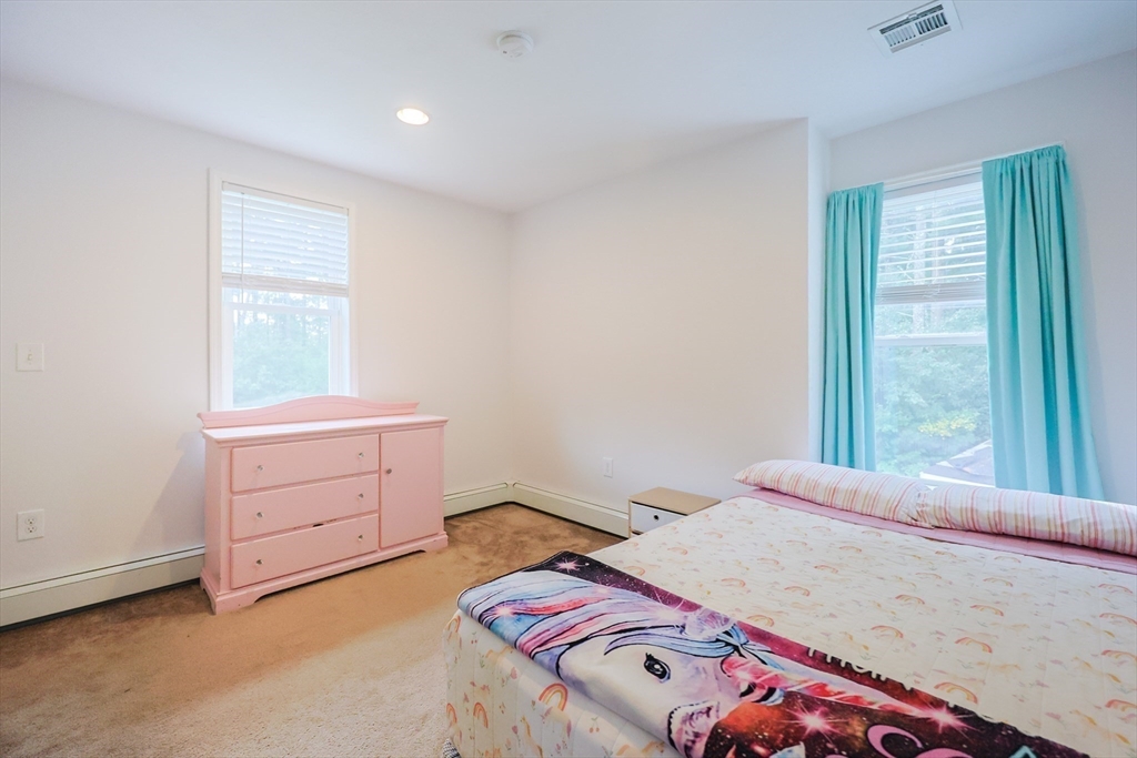 48 Wareham Street Carver, MA 02330 - Photo 32 of 42 a bedroom with a bed and a window