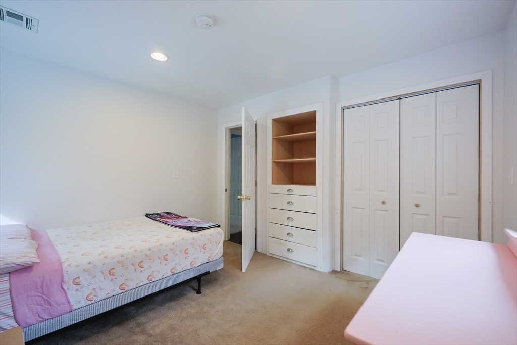 48 Wareham Street Carver, MA 02330 - Photo 33 of 42 a bedroom with a bed and a closet