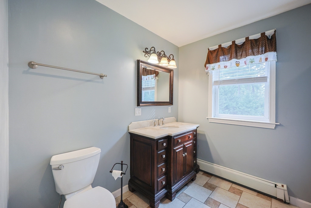 48 Wareham Street Carver, MA 02330 - Photo 35 of 42 a bathroom with a sink a toilet and a mirror