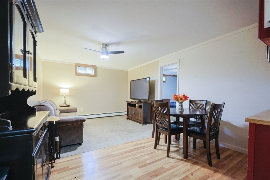 48 Wareham Street Carver, MA 02330 - Photo 37 of 42 a view of a dining room with furniture and wooden floor