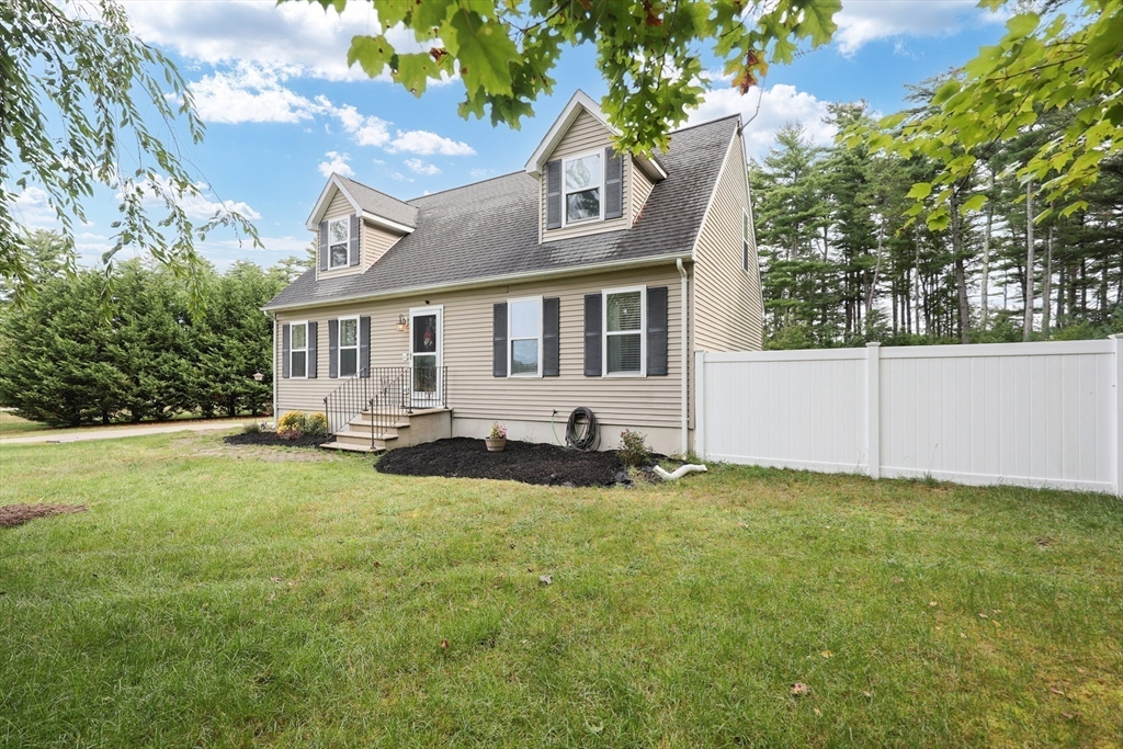 48 Wareham Street Carver, MA 02330 - Photo 5 of 42 a front view of a house with yard