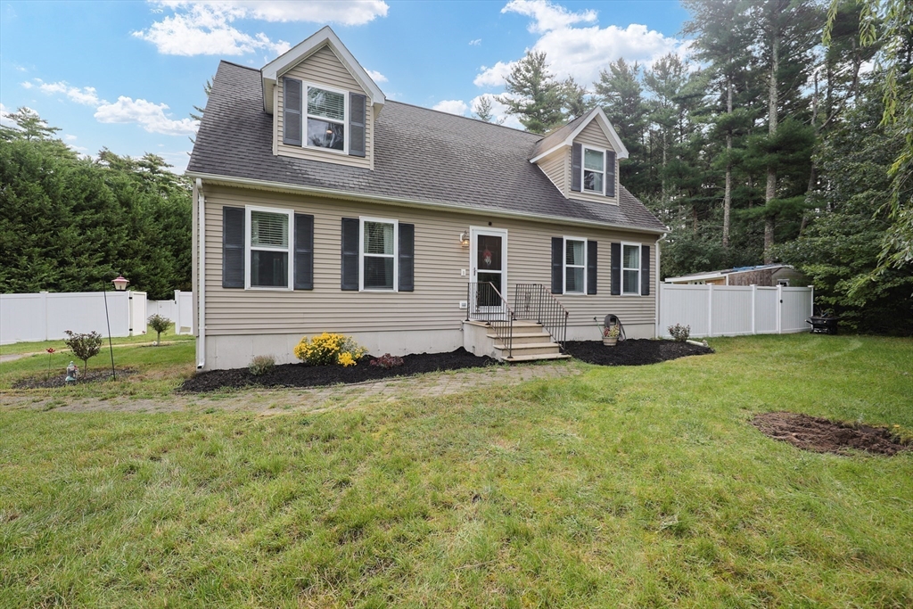 48 Wareham Street Carver, MA 02330 - Photo 6 of 42 a house view with a garden space