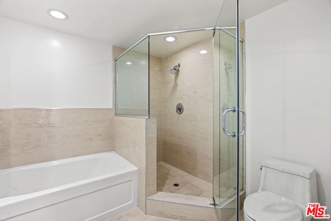220 East Broadway, Unit 202 Glendale, CA 91205 - Photo 9 of 13 a bathroom with a shower and a toilet