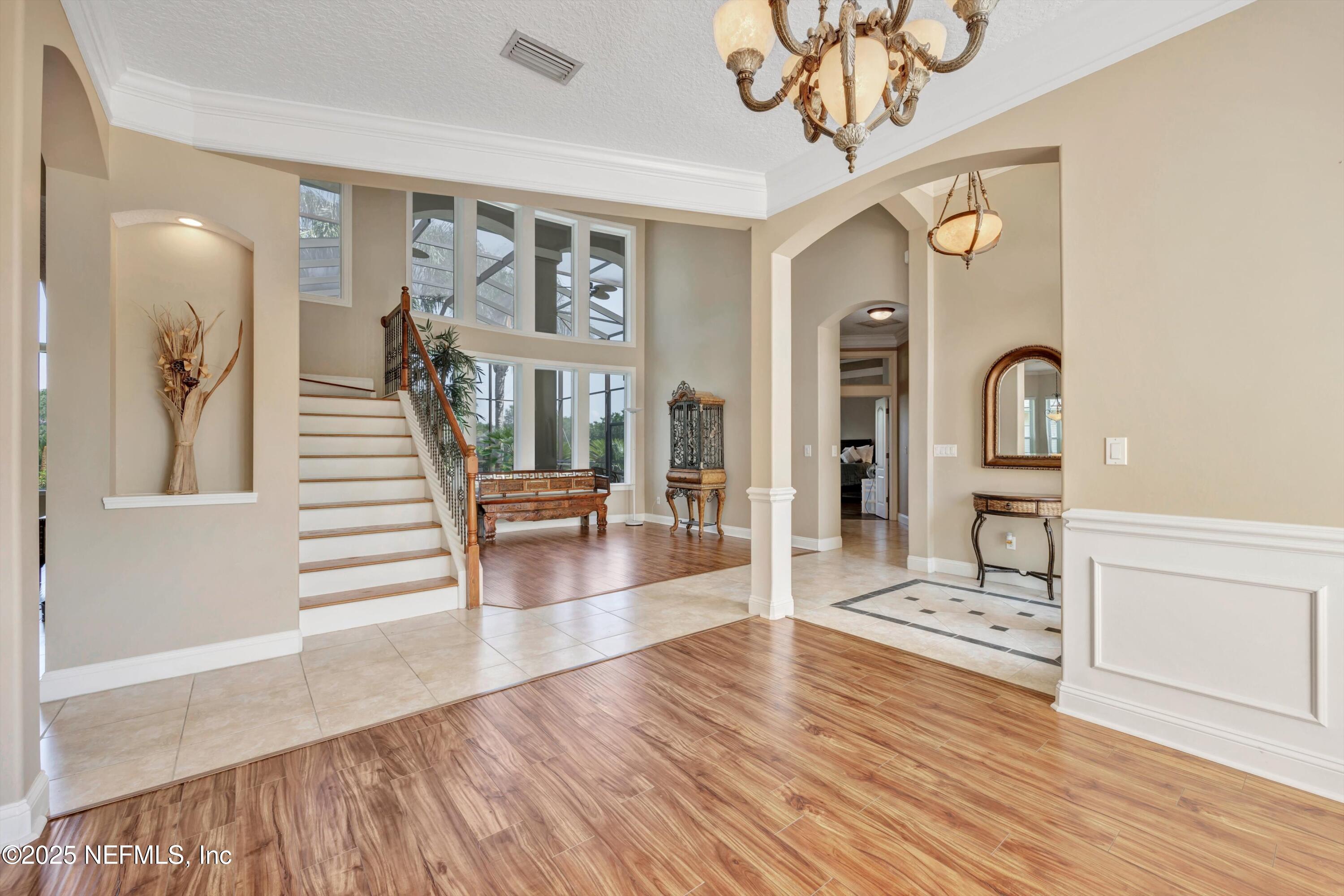 168 Pinehurst Pointe Drive St. Augustine, FL 32092 - Photo 13 of 72 a view of a livingroom with furniture wooden floor & a chandelier