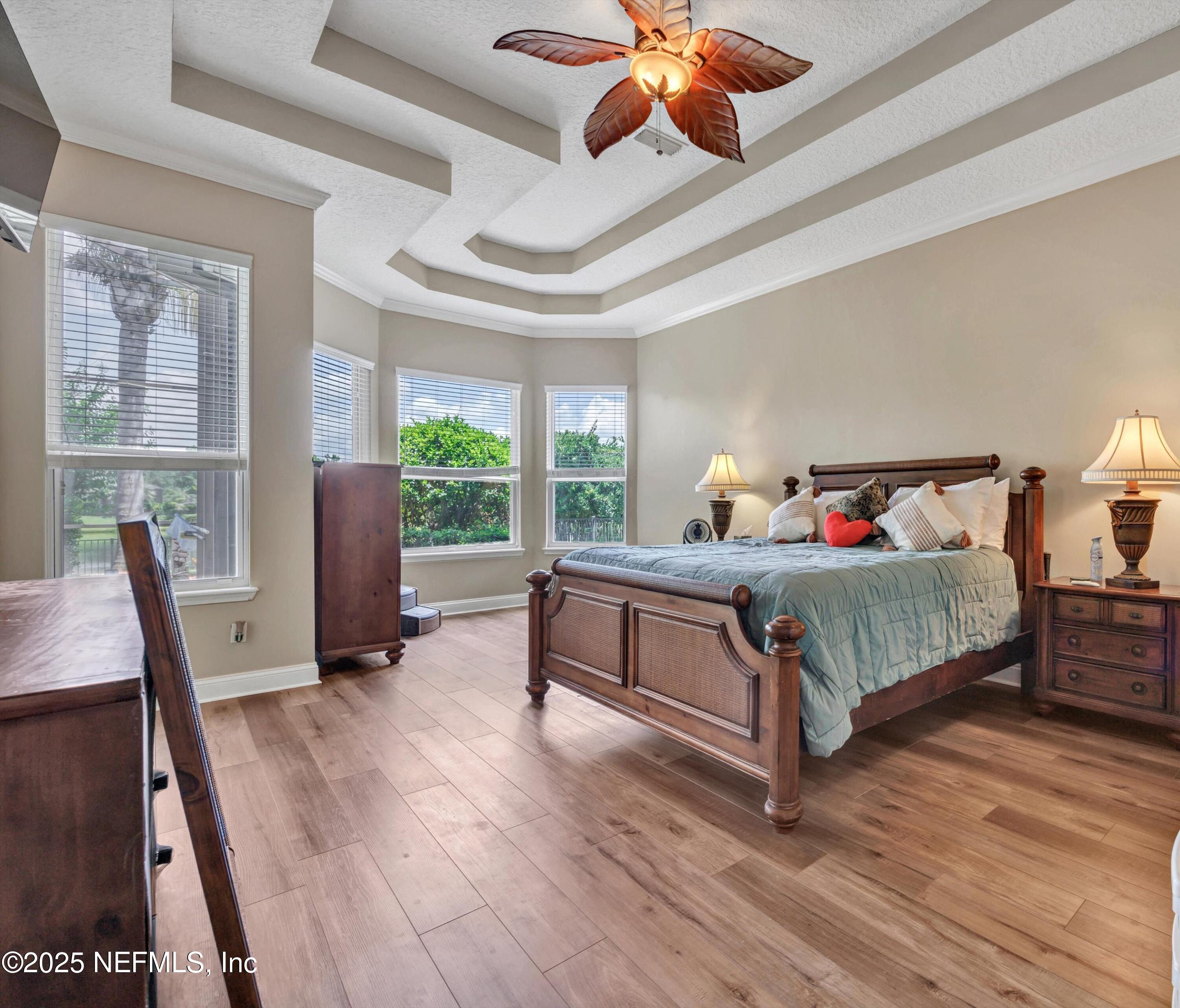 168 Pinehurst Pointe Drive St. Augustine, FL 32092 - Photo 25 of 72 a bedroom with a bed wooden floor and window