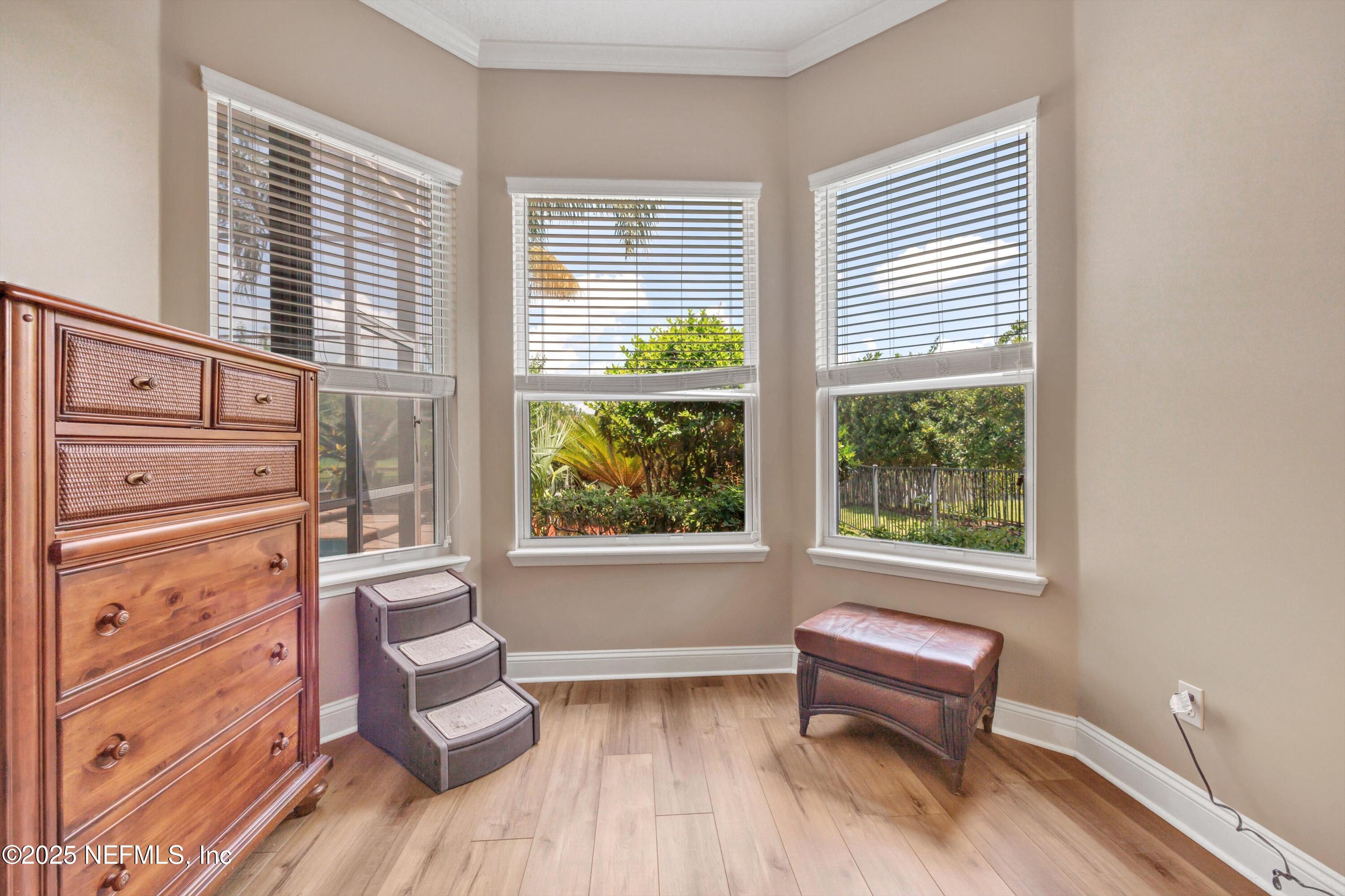 168 Pinehurst Pointe Drive St. Augustine, FL 32092 - Photo 27 of 72 a living room with furniture and a window