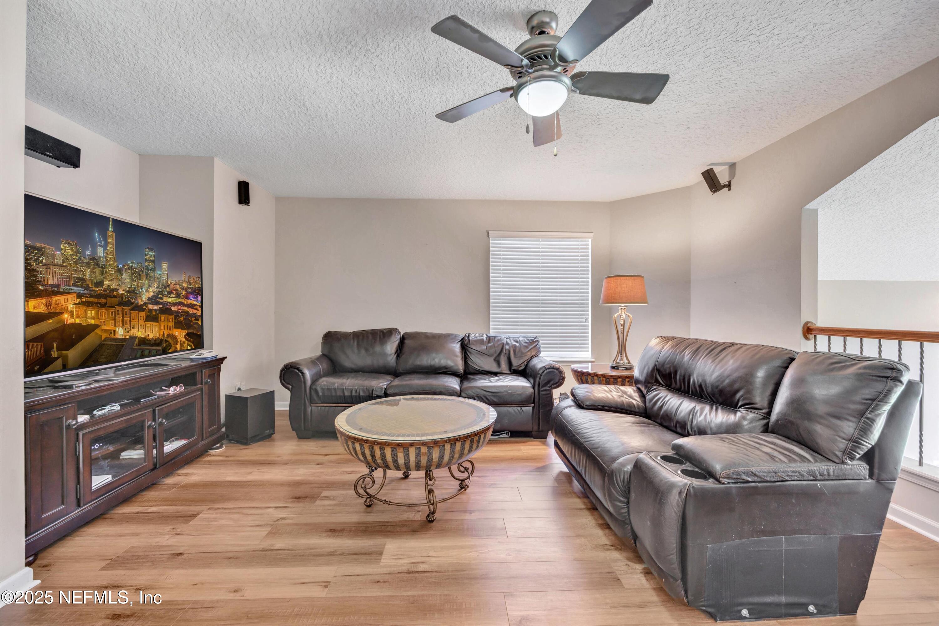 168 Pinehurst Pointe Drive St. Augustine, FL 32092 - Photo 32 of 72 a living room with furniture and a flat screen tv