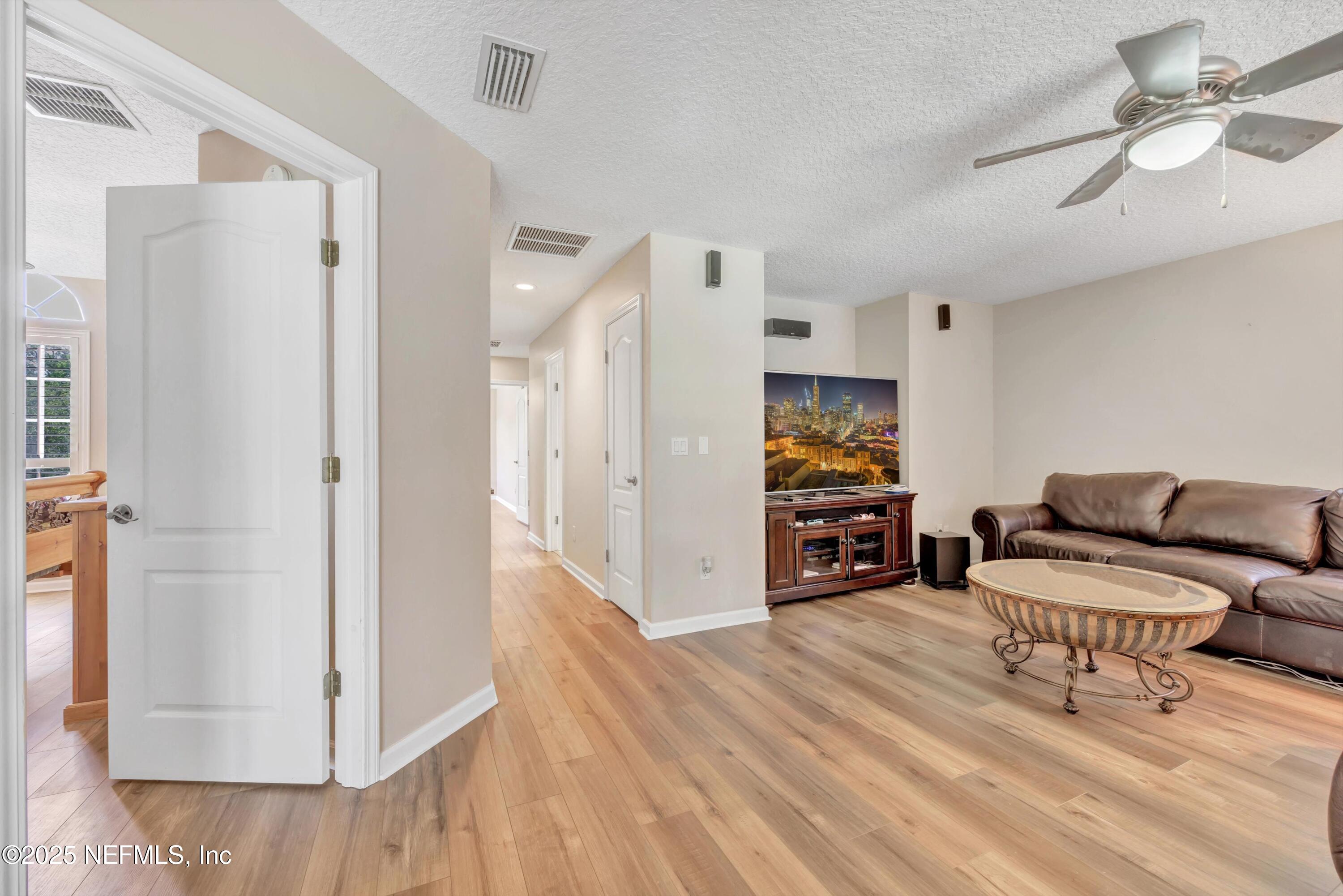 168 Pinehurst Pointe Drive St. Augustine, FL 32092 - Photo 33 of 72 a living room with furniture and wooden floor