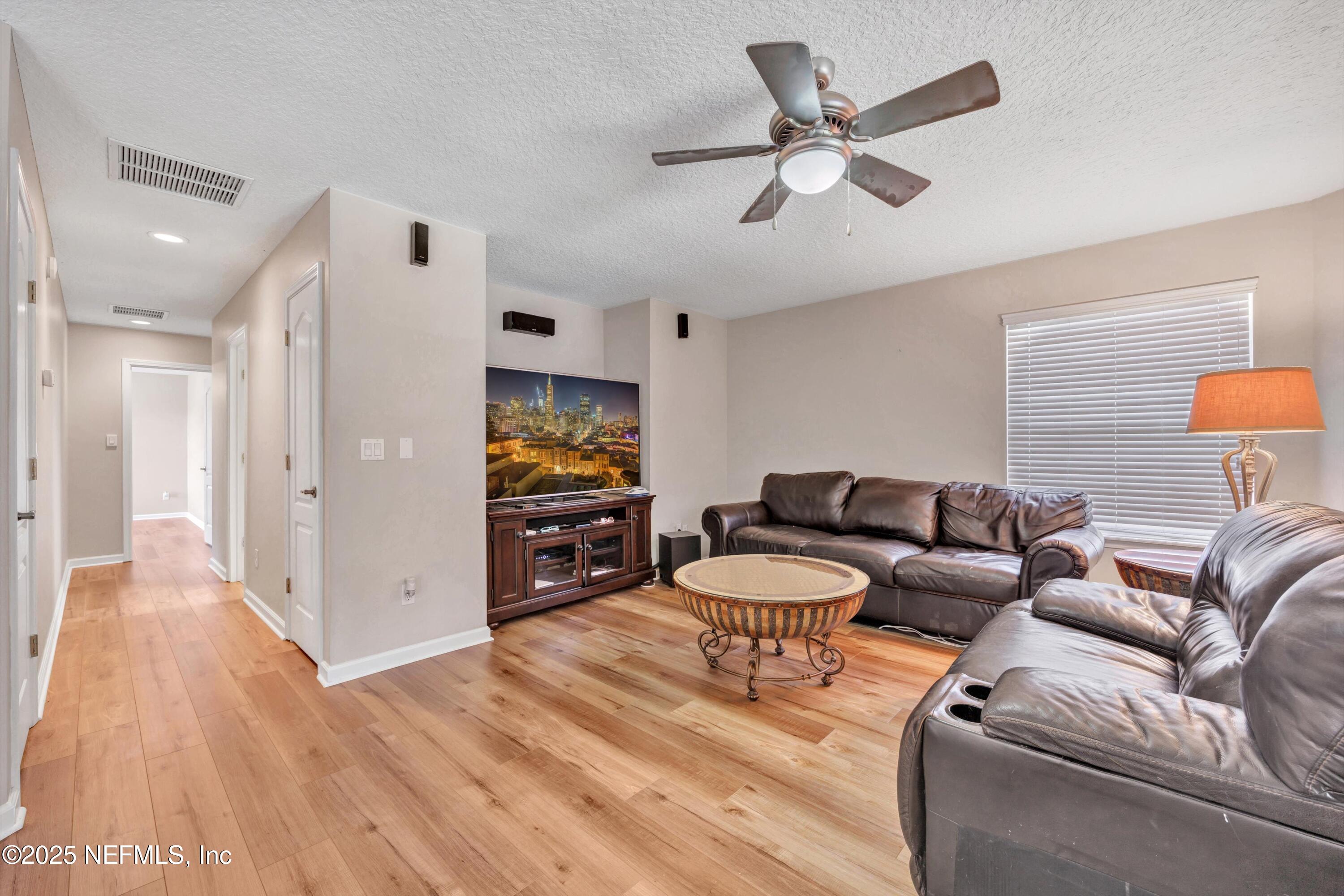 168 Pinehurst Pointe Drive St. Augustine, FL 32092 - Photo 34 of 72 a living room with furniture and a wooden floor