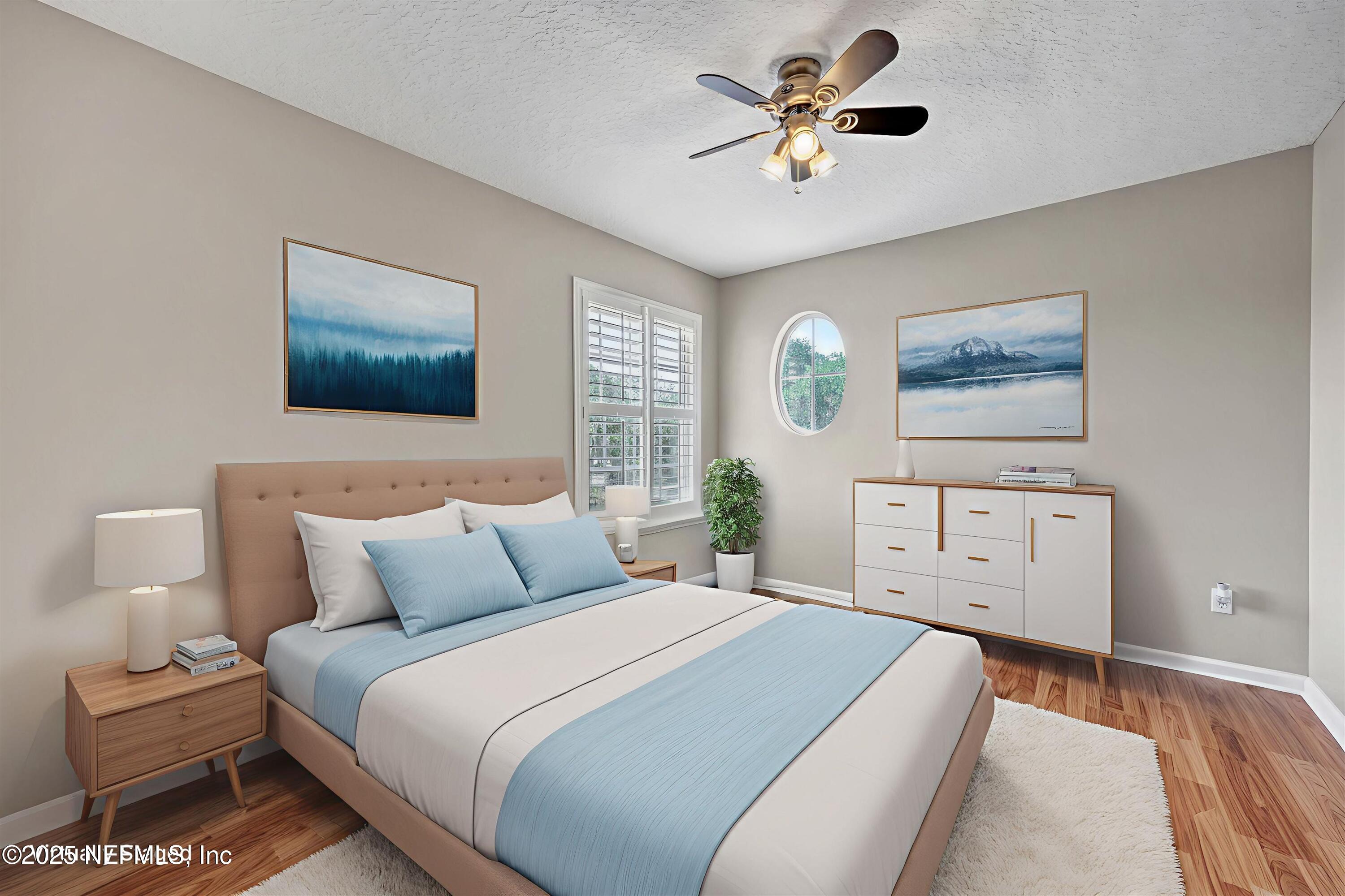 168 Pinehurst Pointe Drive St. Augustine, FL 32092 - Photo 38 of 72 a bedroom with a bed and a chandelier