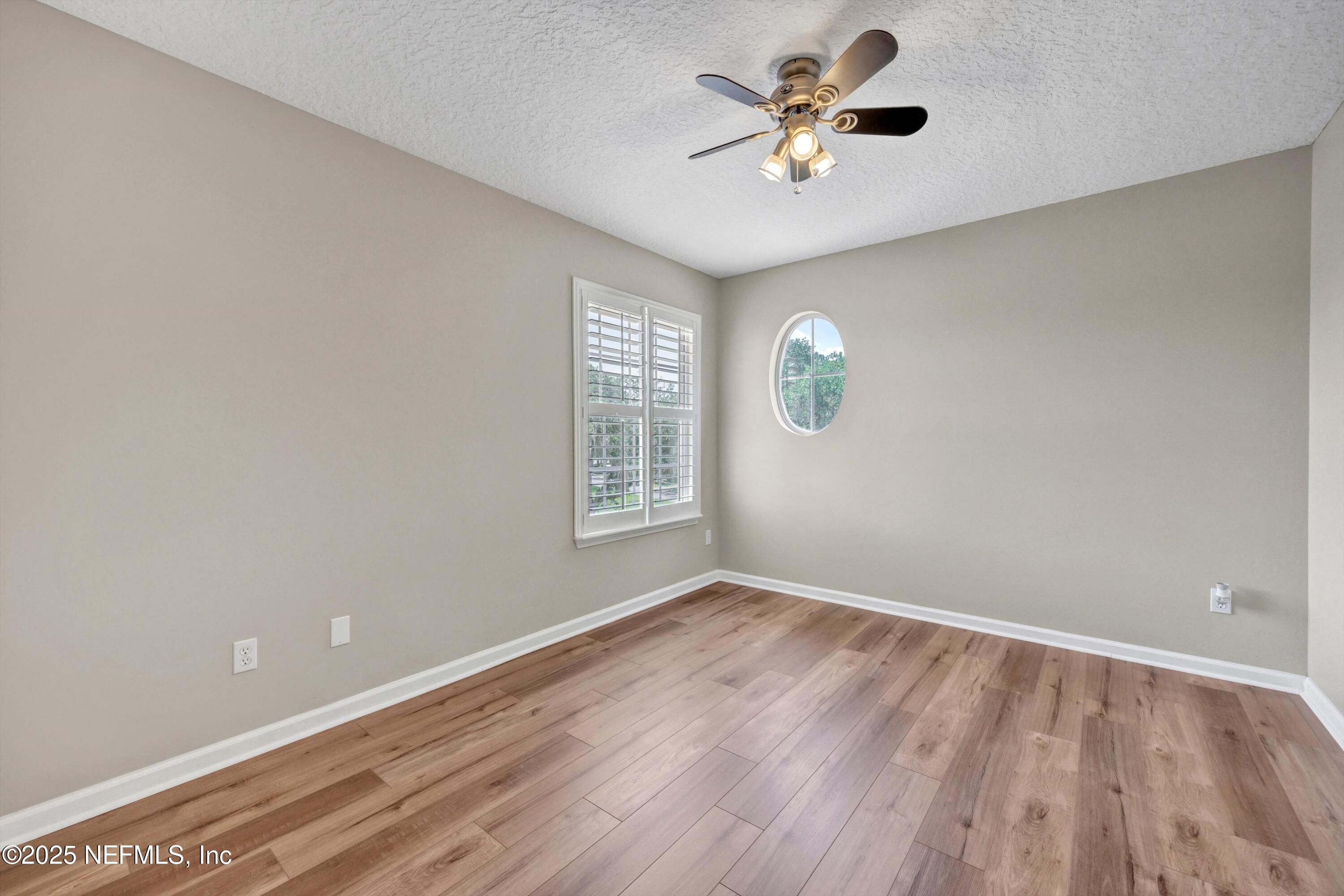 168 Pinehurst Pointe Drive St. Augustine, FL 32092 - Photo 40 of 72 an empty room with a window and a fan