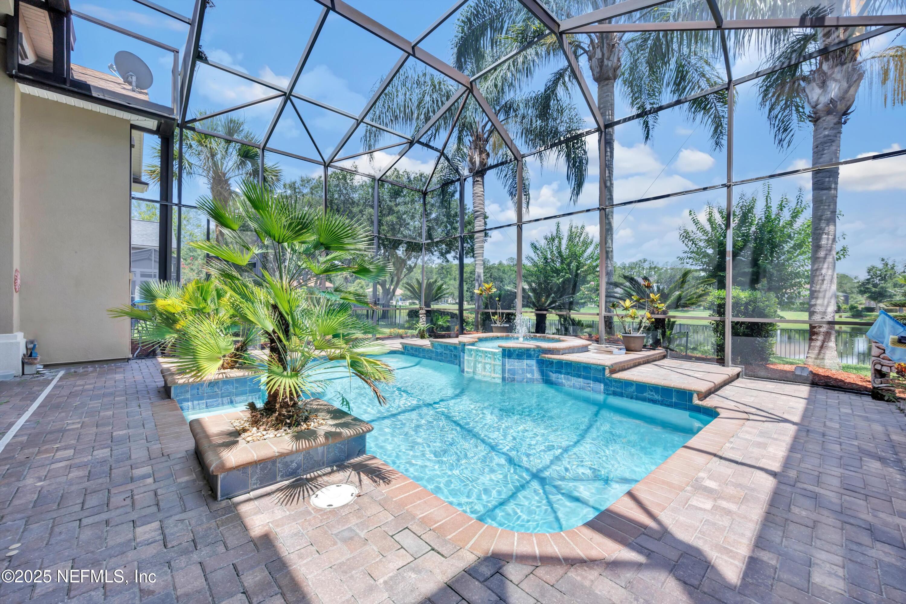 168 Pinehurst Pointe Drive St. Augustine, FL 32092 - Photo 48 of 72 a view of a backyard with plants and a patio
