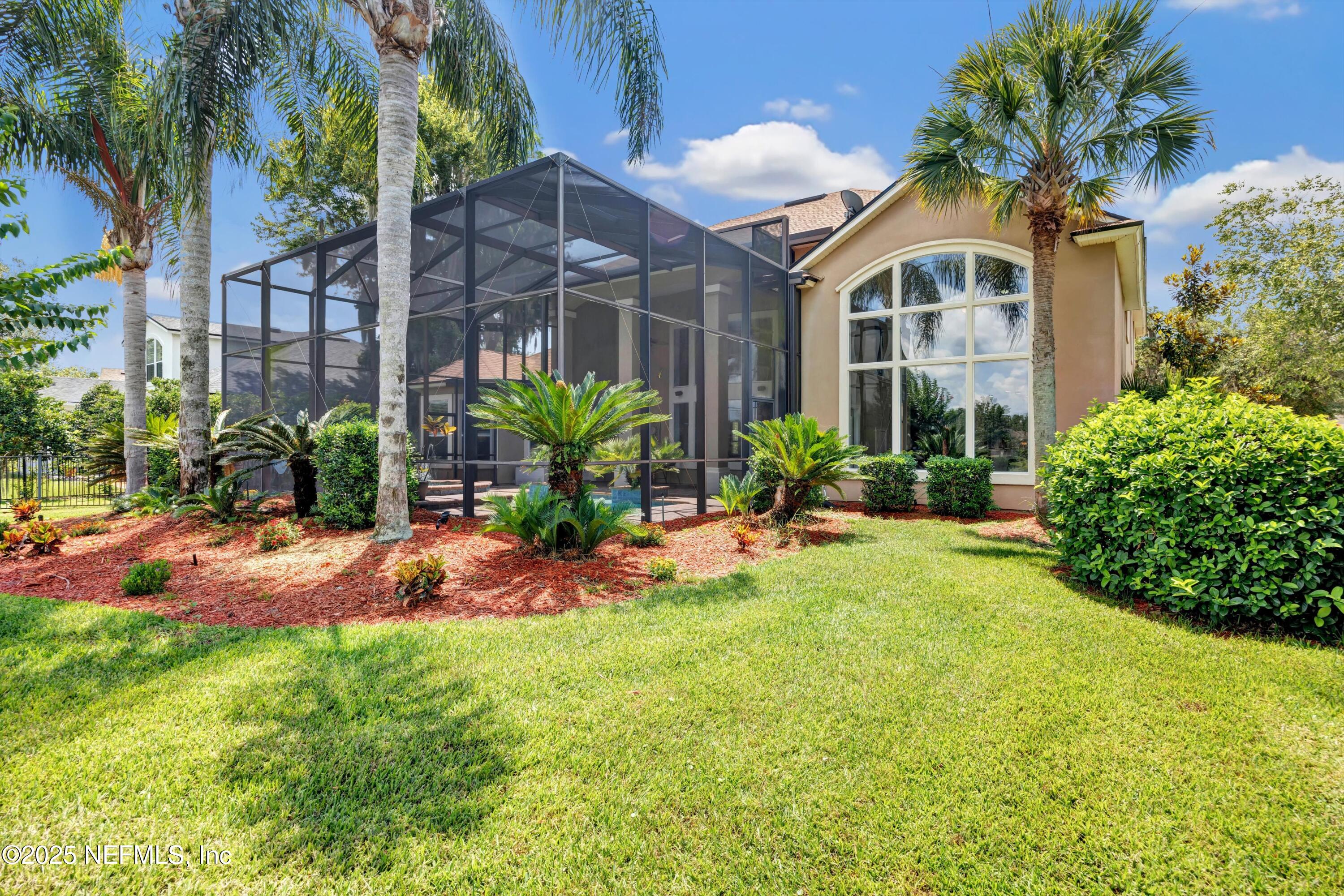 168 Pinehurst Pointe Drive St. Augustine, FL 32092 - Photo 49 of 72 a front view of house with yard and outdoor seating