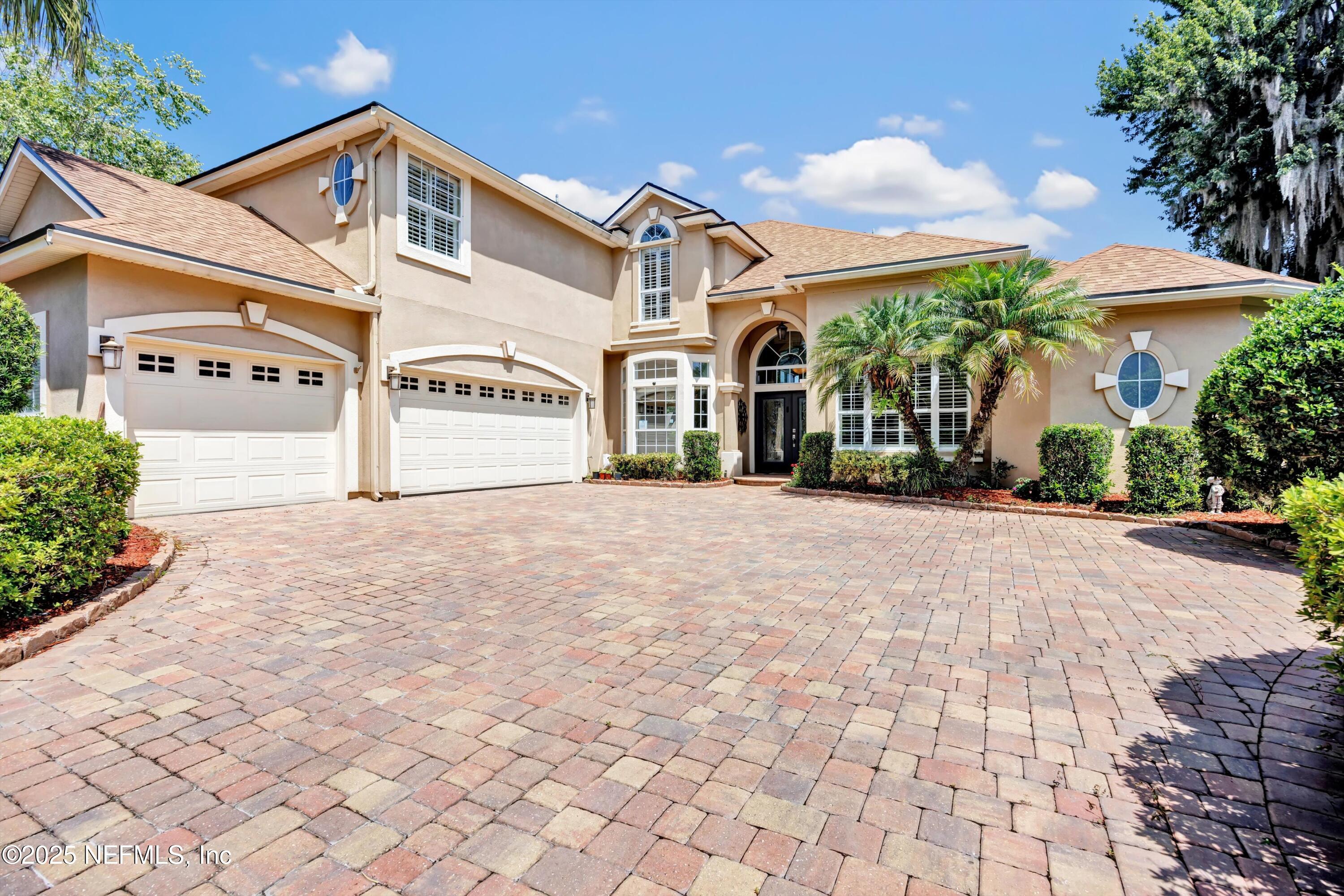 168 Pinehurst Pointe Drive St. Augustine, FL 32092 - Photo 50 of 72 a front view of a building with garden