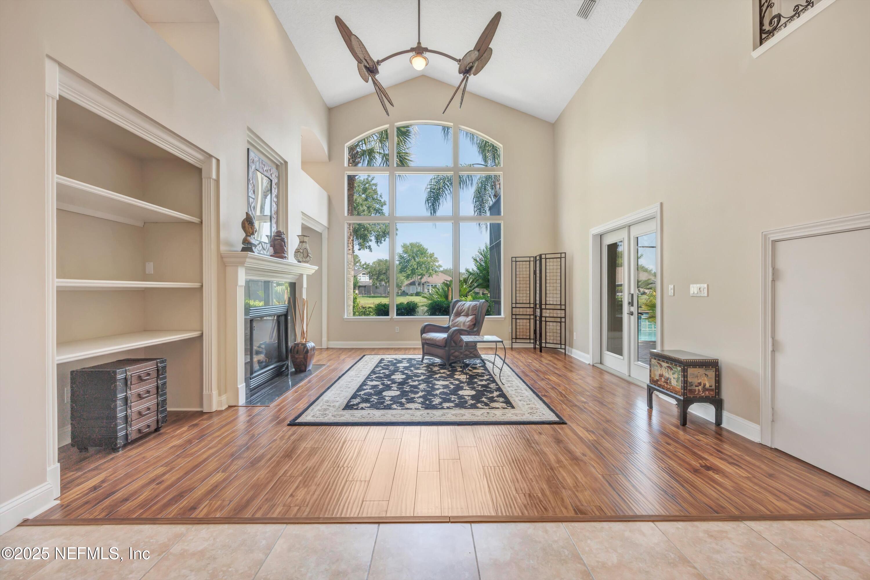 168 Pinehurst Pointe Drive St. Augustine, FL 32092 - Photo 7 of 72 a living room with furniture fireplace and wooden floor