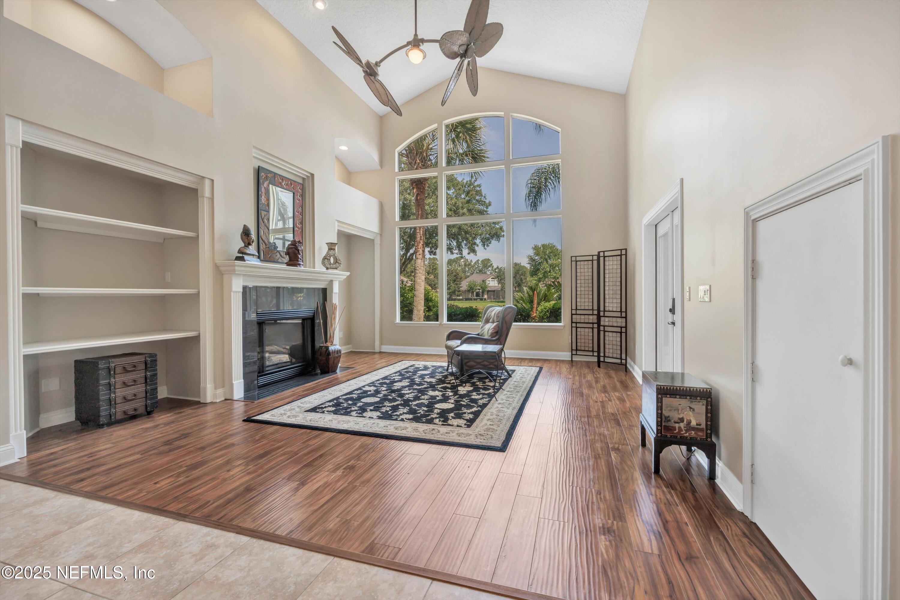 168 Pinehurst Pointe Drive St. Augustine, FL 32092 - Photo 8 of 72 a living room with furniture and a fireplace