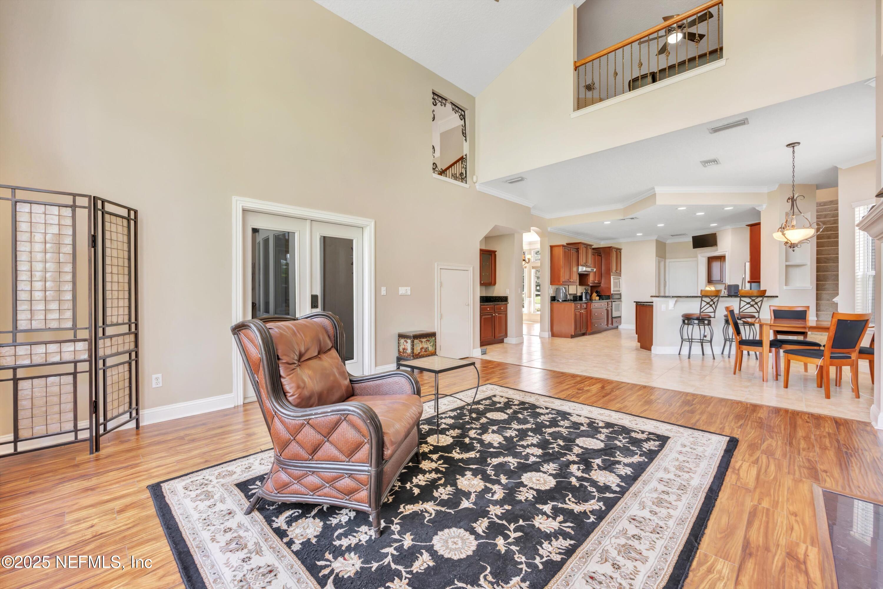 168 Pinehurst Pointe Drive St. Augustine, FL 32092 - Photo 9 of 72 a living room with furniture and wooden floor