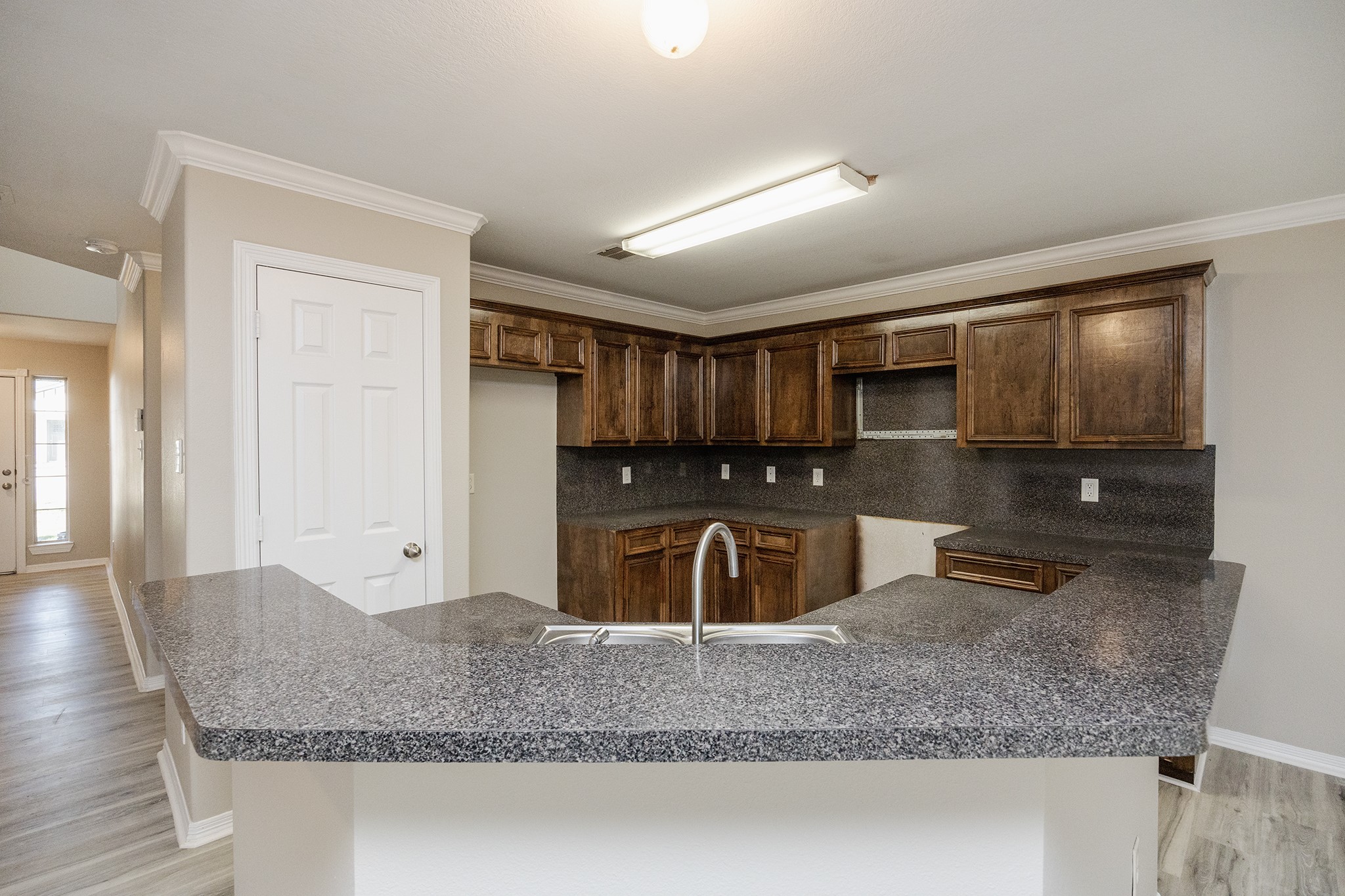 4624 Larkspur Street, Unit B Houston, TX 77051 - Photo 16 of 49 a kitchen with granite countertop a sink and a granite counter tops