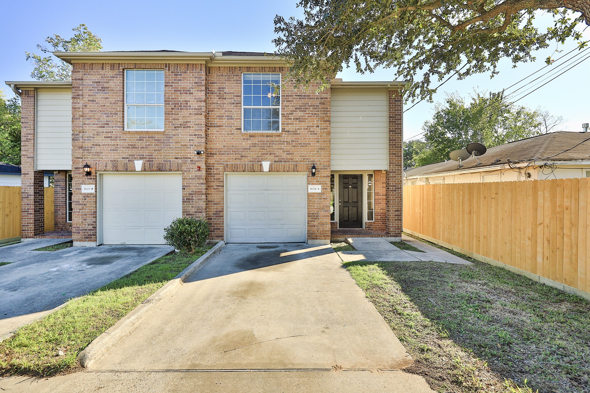 4624 Larkspur Street, Unit B Houston, TX 77051 - Photo 2 of 49 a front view of a house with garden