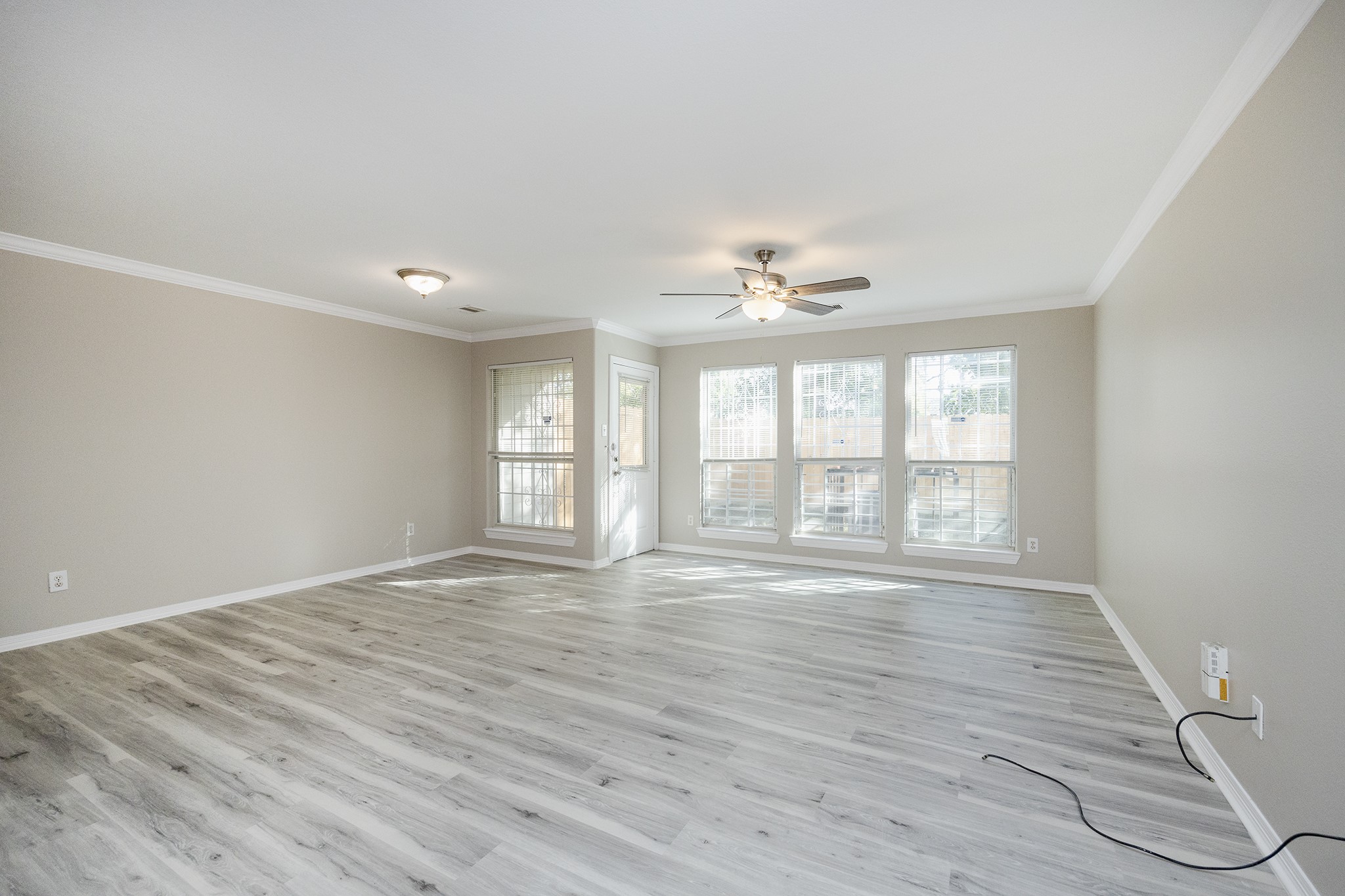 4624 Larkspur Street, Unit B Houston, TX 77051 - Photo 21 of 49 a view of an empty room with wooden floor and a window